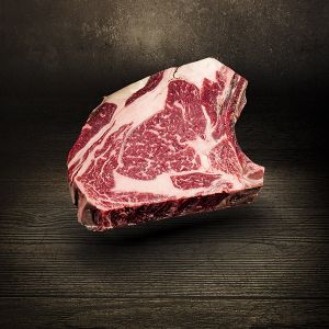 Prime Rib Steak Dry Aged 700g vom Simmentaler Rind vier bis acht Wochen am Knochen in Ludwigs Carnothek gereift besonders durchwachsenes Steak kräftig im Geschmack ideal zur Zubereitung auf dem Grill oder in der Pfanne Prime Rib Steak Dry Aged bei Der Lud